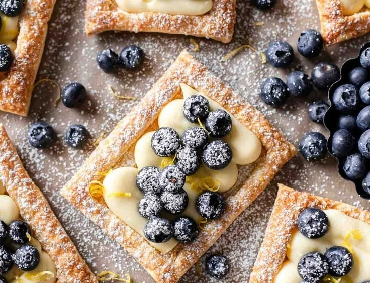 Delicious Blueberry Lemon Cream Pastries with fresh blueberries and lemon zest.