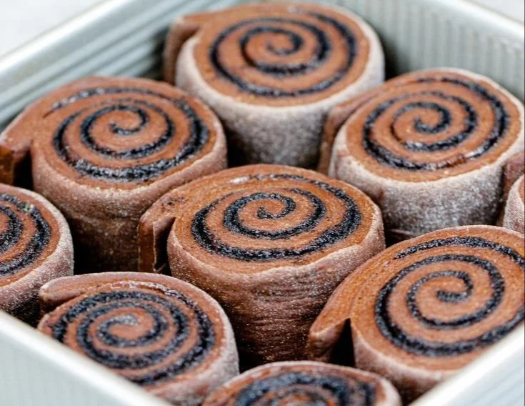 Delicious homemade chocolate cinnamon rolls on a baking tray