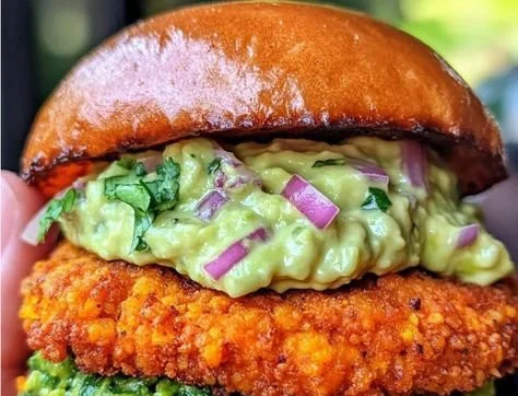 Crispy sweet potato and red lentil patties served with avocado cilantro sauce