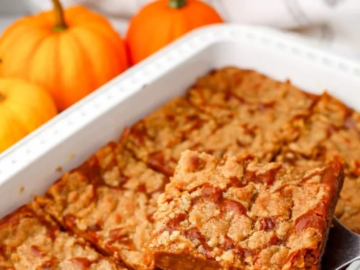 Delicious easy vegan pumpkin pie cake topped with whipped cream and spices.