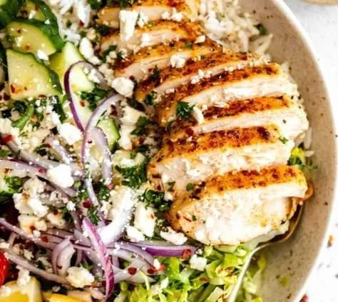 Greek-inspired chicken bowls with fresh veggies and flavorful spices