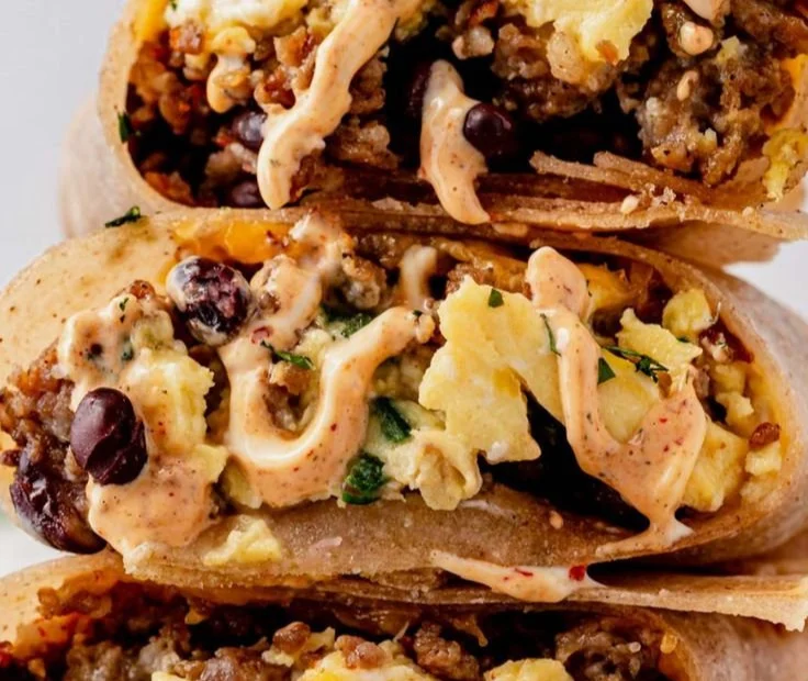 High-protein breakfast burrito filled with eggs, beans, and vegetables.
