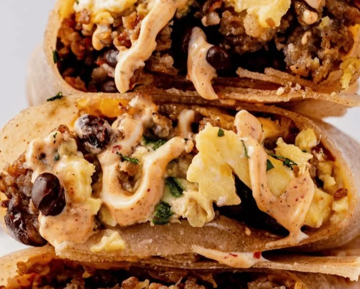 High-protein breakfast burrito filled with eggs, beans, and veggies