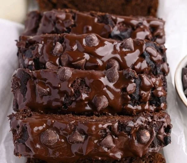 High-protein chocolate banana bread fresh out of the oven, topped with chocolate chips.
