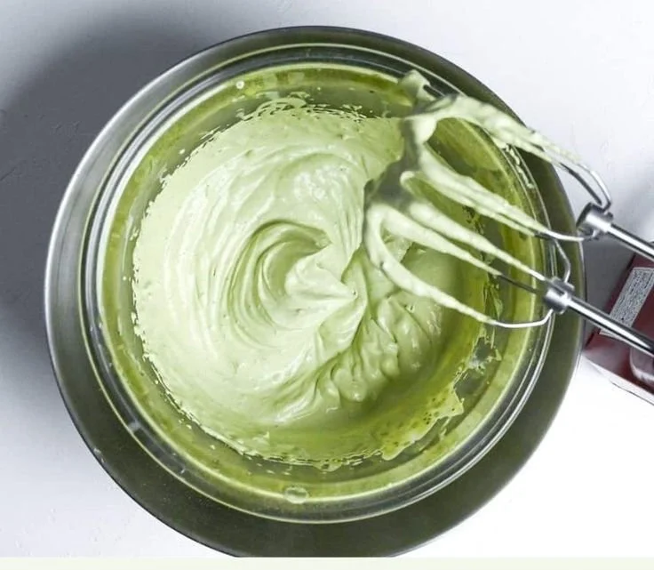 No-Bake Matcha Rare Cheesecake garnished with matcha powder on a plate