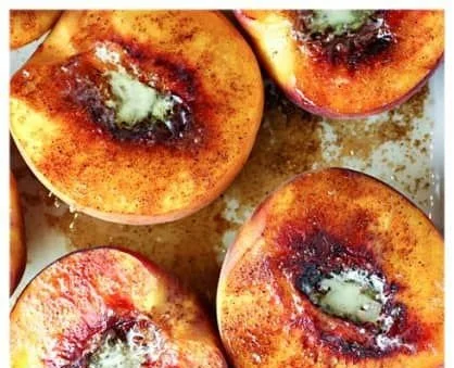 Baked peaches topped with cinnamon sugar for a warm dessert