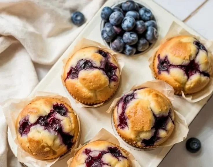 Protein-packed cottage cheese blueberry muffins on a wooden table