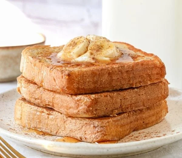 Delicious protein powder French toast served on a plate with fresh berries.