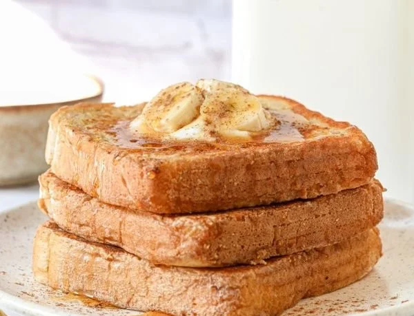 Delicious protein powder French toast topped with fresh berries and syrup