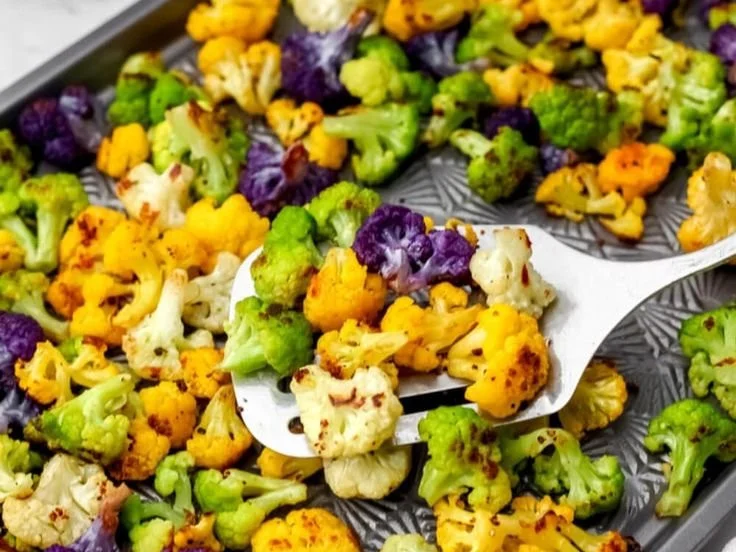Colorful rainbow roasted cauliflower dish with spices and herbs