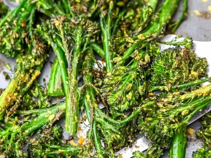 Roasted tenderstem broccoli served on a plate with spices