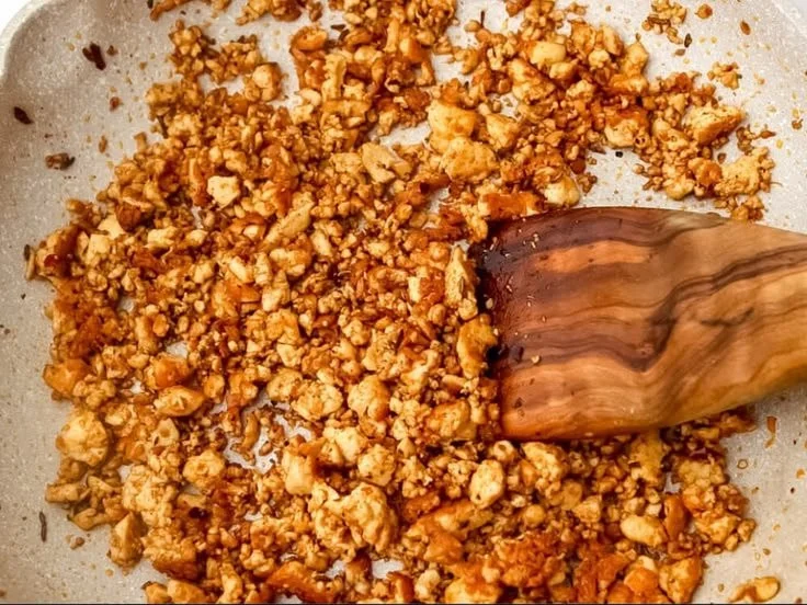Tofu sausage crumbles in a skillet, perfect for plant-based dishes
