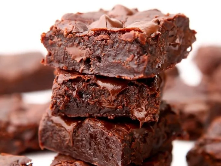 Delicious vegan brownies on a rustic wooden table