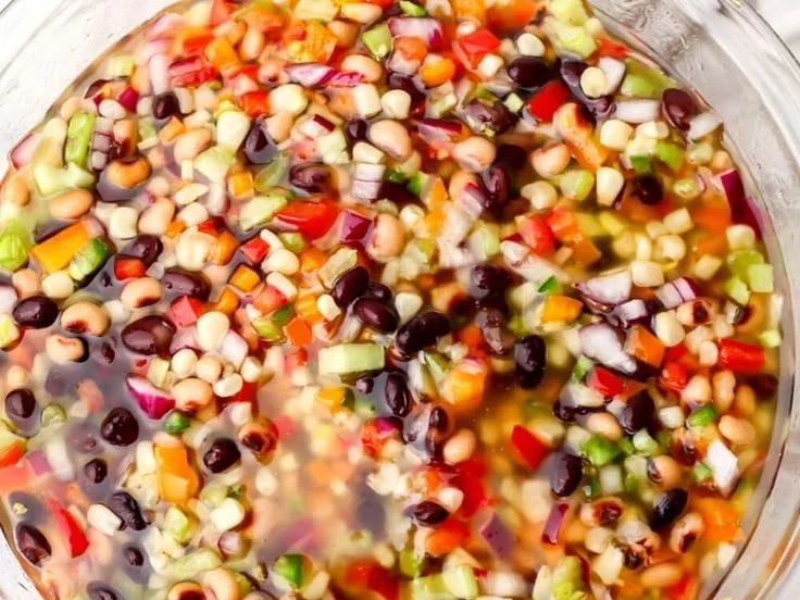 Bowl of vegan cowboy caviar with fresh vegetables and beans