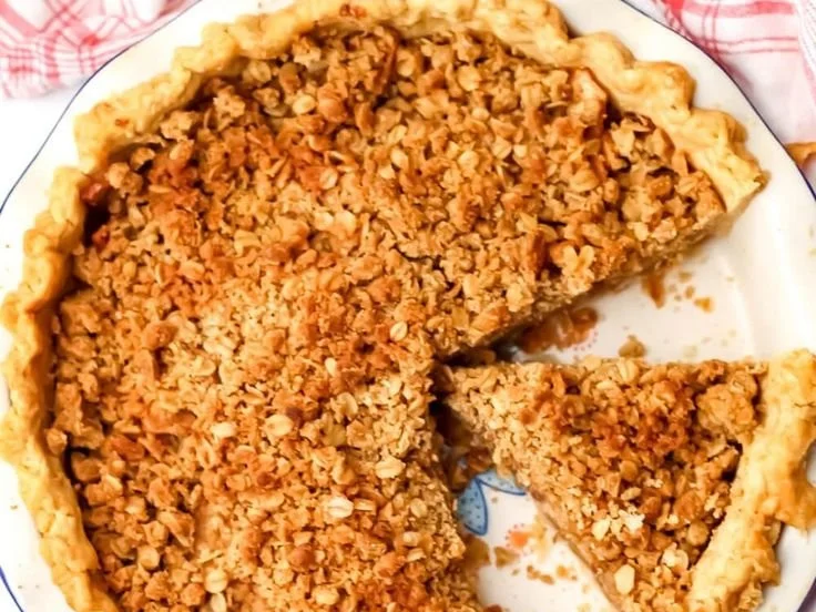 Vegan Dutch Apple Pie topped with fresh apples and a crumbly crust.