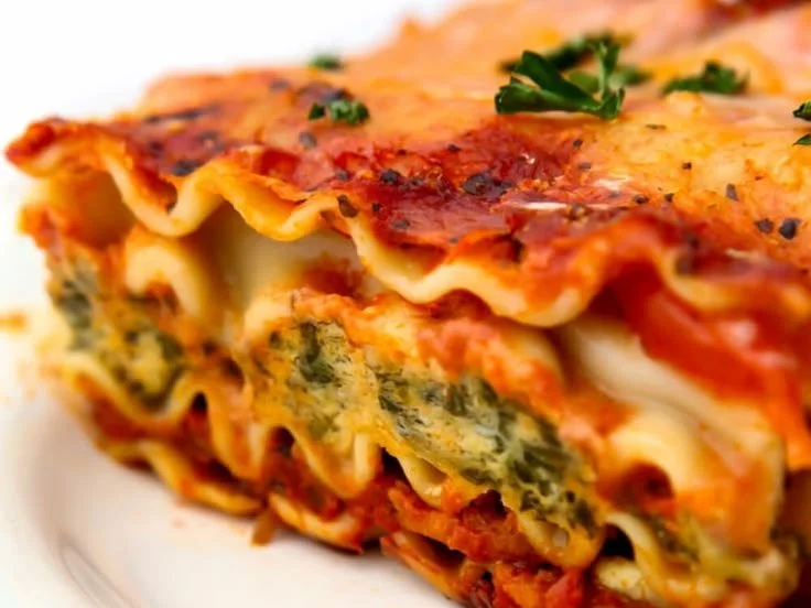 Delicious vegan lasagna layered with vegetables and dairy-free cheese