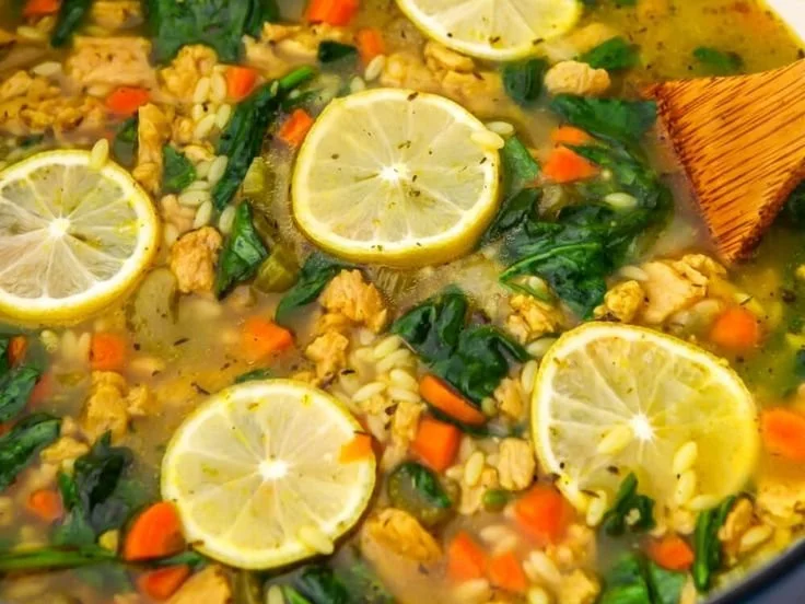 Bowl of Vegan Lemon Spinach Orzo Soup with fresh ingredients and vibrant flavors