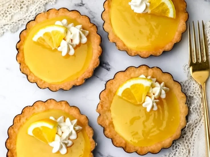 Delicious vegan lemon tarts with a creamy filling and a crispy crust.