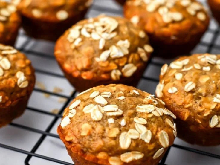 Delicious vegan oat muffins on a cooling rack, perfect for healthy eating.