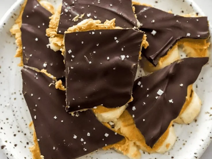 Delicious chocolate banana bark topped with nuts and dried fruit.